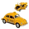 Mattel - Mini Fusca Táxi Amarelo 12cm com Portas Abertas - 1